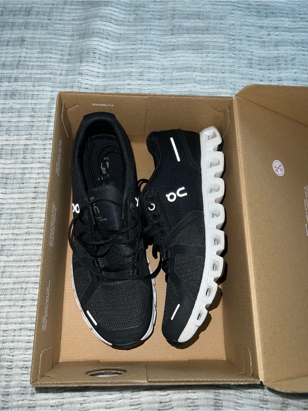 On Cloud Womens Black and White Cloud Sneakers